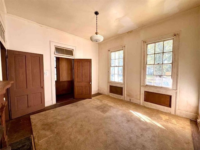 interior space with dark colored carpet and multiple windows