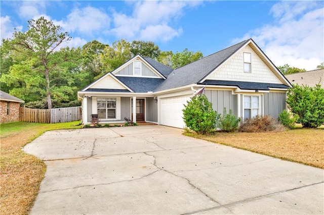 view of front of property featuring a garage and a front lawn