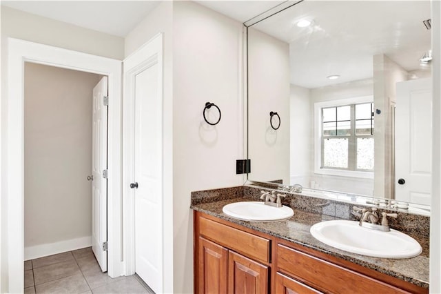 bathroom featuring tile patterned flooring and vanity