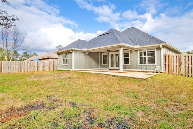 back of house with a yard, a patio, and ceiling fan