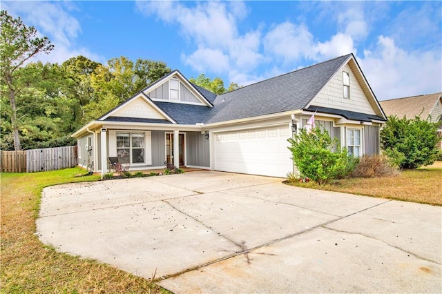 view of front of home with a front lawn and a garage