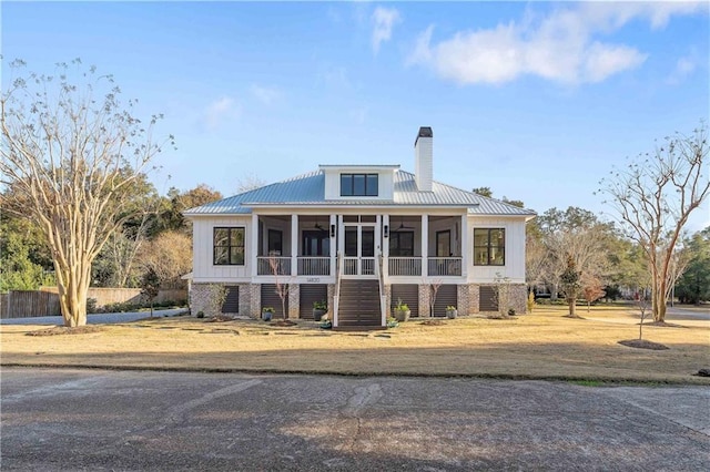 view of front facade with a sunroom