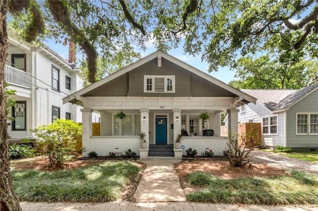 view of front of property with a porch and crawl space