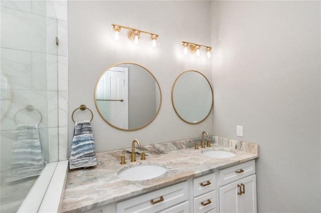 bathroom featuring a sink and double vanity