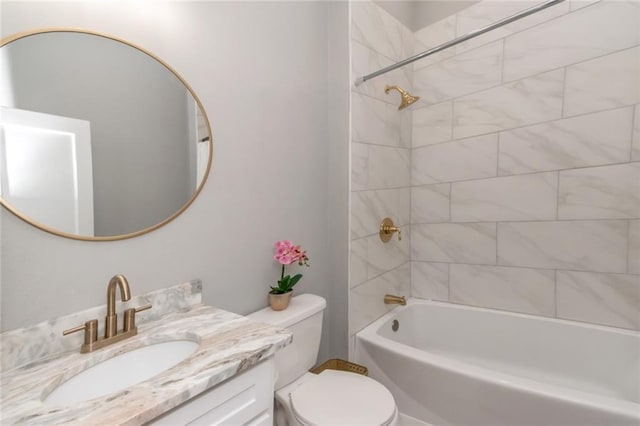 bathroom with vanity, toilet, and washtub / shower combination