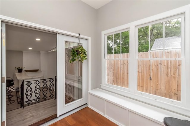 entryway with wood finished floors