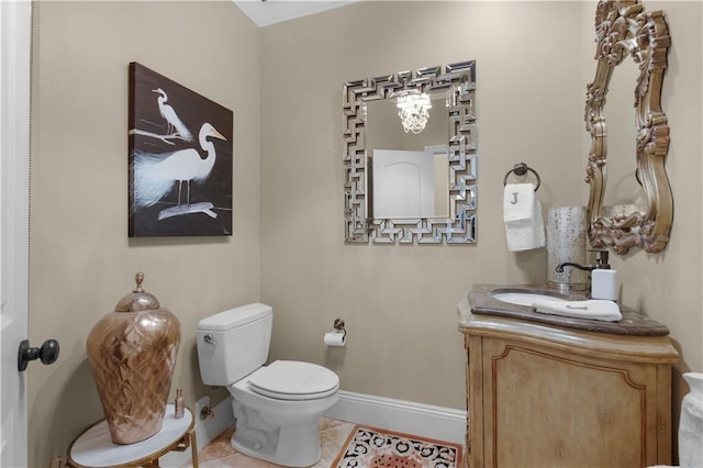 bathroom with vanity, tile patterned floors, and toilet