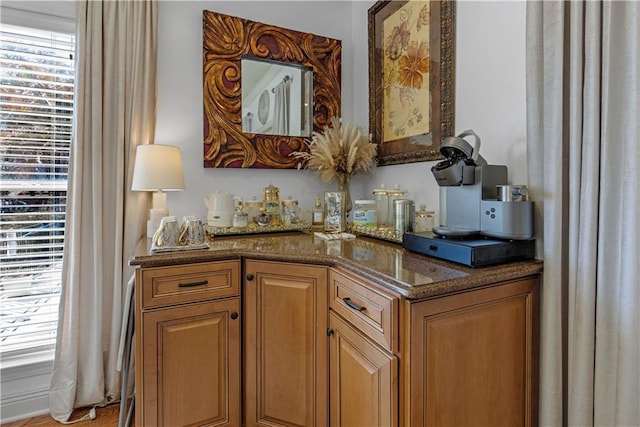 bar featuring dark stone countertops