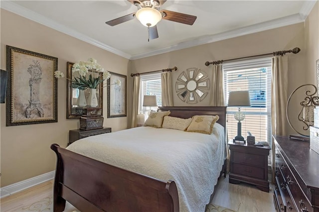 bedroom with crown molding, multiple windows, and light hardwood / wood-style flooring