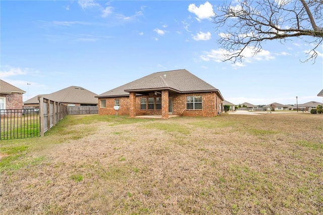 back of house with a yard