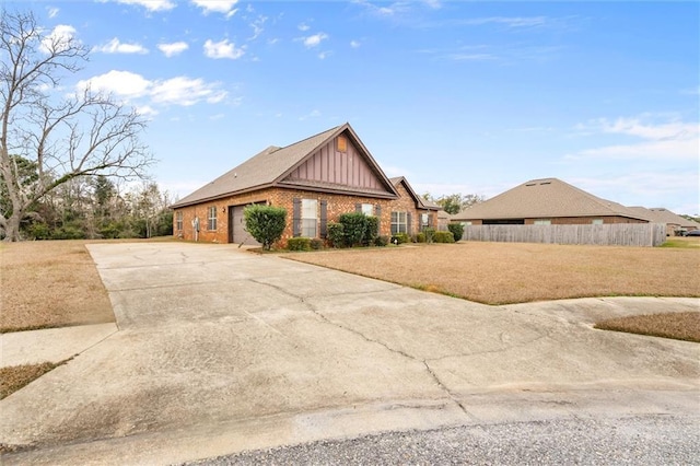 view of front facade with a front yard and a garage