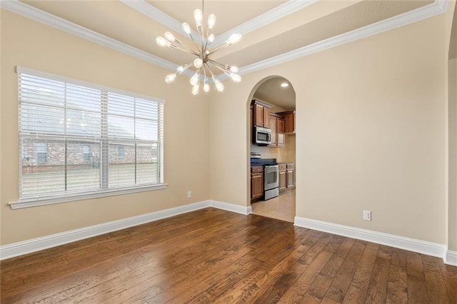 interior space featuring dark wood-type flooring, crown molding, and a chandelier