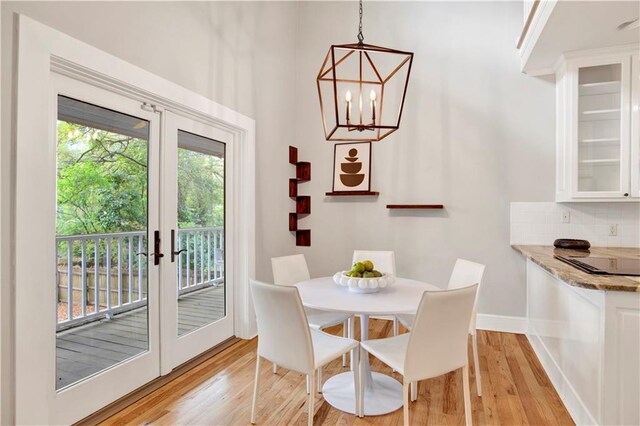 kitchen featuring white cabinets, appliances with stainless steel finishes, sink, and light hardwood / wood-style flooring