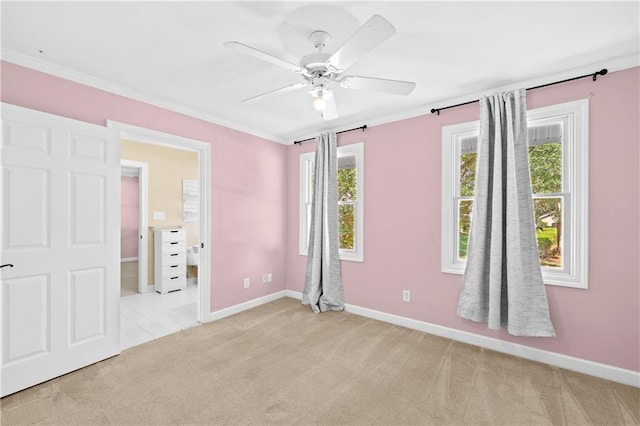 unfurnished bedroom with ornamental molding, ceiling fan, and light carpet