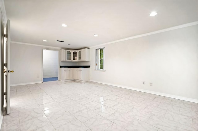 unfurnished living room featuring ornamental molding