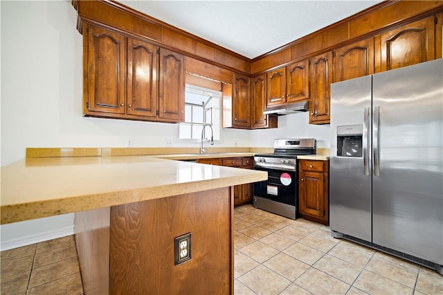 kitchen with sink, a breakfast bar area, light tile patterned floors, kitchen peninsula, and stainless steel appliances