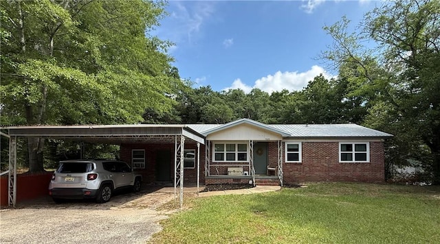 7020 Moffett Rd, Mobile, AL 36618 - ranch-style home featuring a front yard, concrete driveway, brick siding, and metal roof