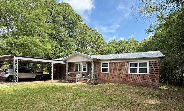 7020 Moffett Rd, Mobile, AL 36618 - ranch-style house featuring a carport, a front lawn, brick siding, and metal roof