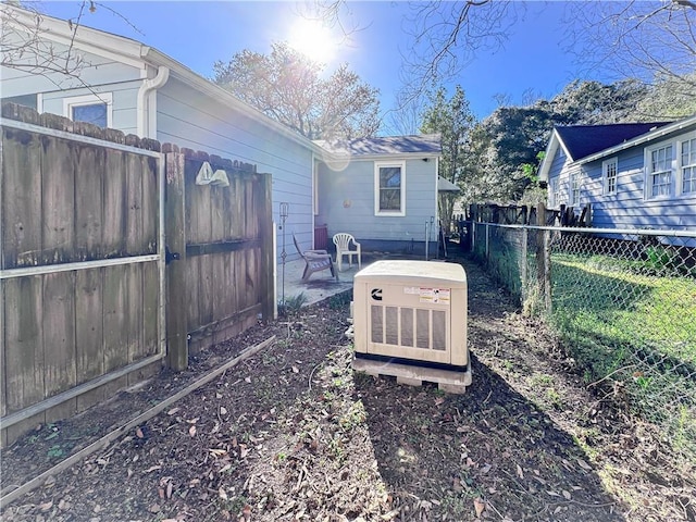 view of yard with a patio area and a fenced backyard