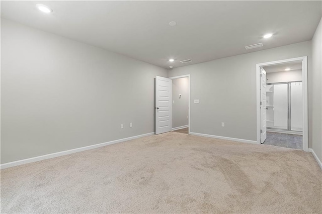 empty room featuring light colored carpet