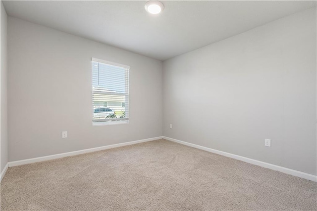 unfurnished room featuring carpet flooring