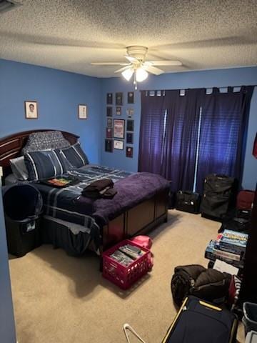 carpeted bedroom featuring a textured ceiling and ceiling fan