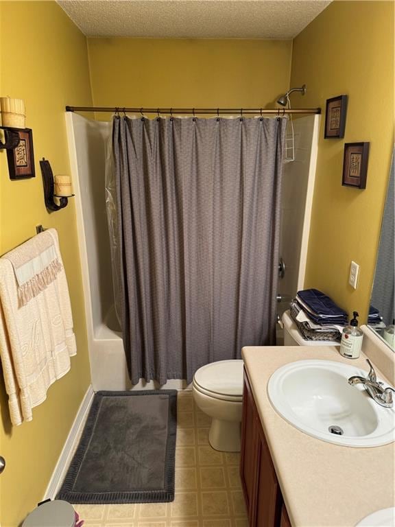 full bathroom with vanity, toilet, a textured ceiling, and shower / tub combo with curtain