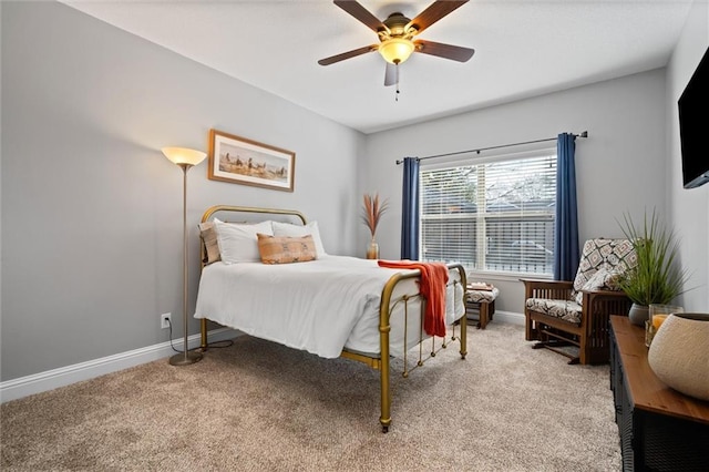 bedroom featuring light colored carpet and ceiling fan