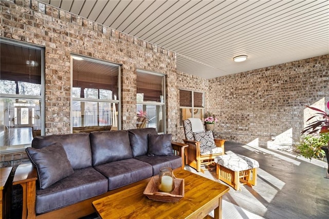 living room with brick wall