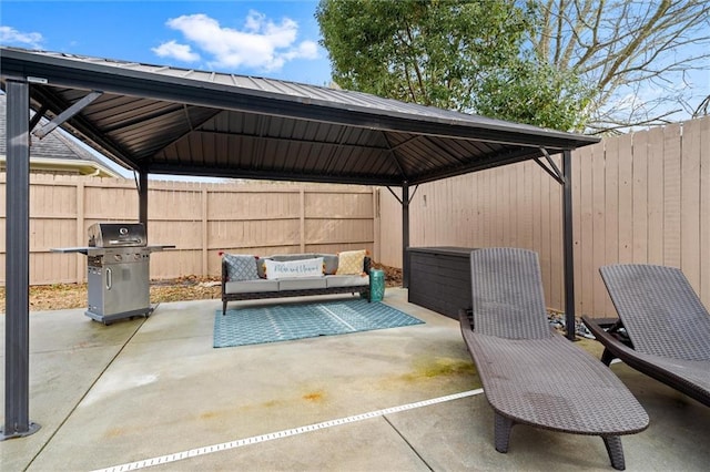 view of patio / terrace with area for grilling, a gazebo, and an outdoor hangout area