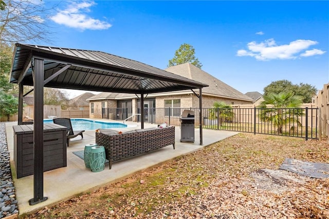 exterior space featuring a fenced in pool, a gazebo, and outdoor lounge area