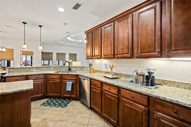 kitchen featuring light tile patterned flooring, decorative light fixtures, dishwasher, sink, and a raised ceiling