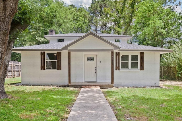 3201 Lees Ln, Mobile, AL 36693 - view of front facade featuring brick siding, a chimney, roof with shingles, and a porch