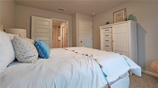 carpeted bedroom with a closet