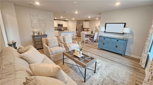 living room featuring light wood-type flooring