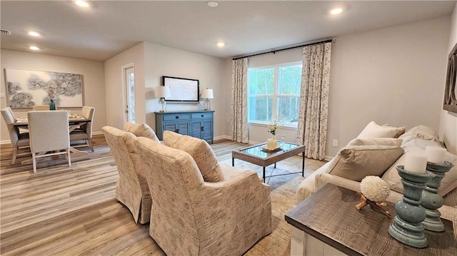 living room with light hardwood / wood-style floors