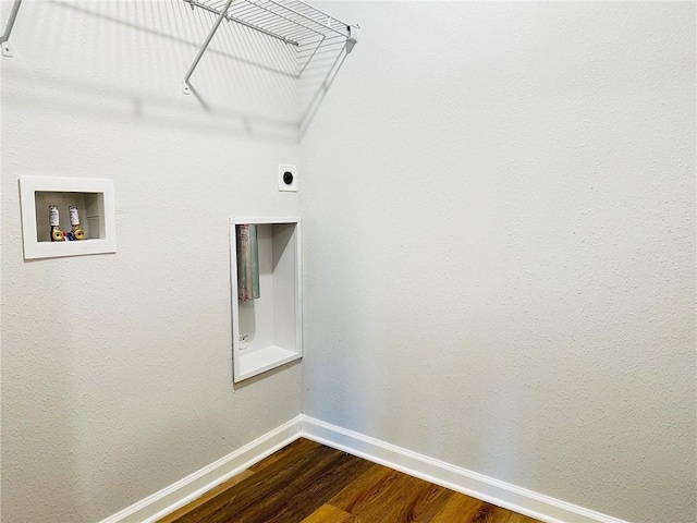 clothes washing area featuring hardwood / wood-style flooring, washer hookup, and electric dryer hookup