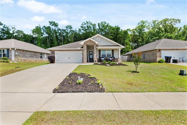 2526 Windmere Dr E, Semmes, AL 36575 - view of front of property featuring brick siding, a garage, a front lawn, and driveway