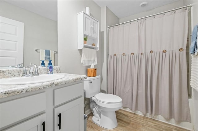 2526 Windmere Dr E, Semmes, AL 36575 - bathroom with toilet, wood finished floors, and vanity
