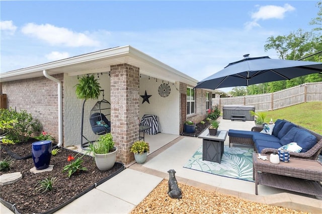 2526 Windmere Dr E, Semmes, AL 36575 - view of patio with fence, an outdoor hangout area, and a hot tub