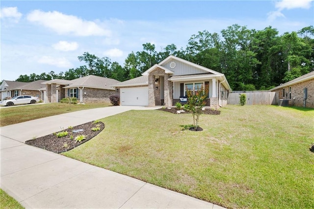 2526 Windmere Dr E, Semmes, AL 36575 - single story home with concrete driveway, brick siding, an attached garage, and a front yard
