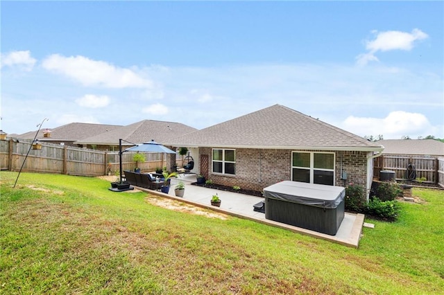 2526 Windmere Dr E, Semmes, AL 36575 - back of house with outdoor lounge area, a fenced backyard, a patio area, a hot tub, and a yard