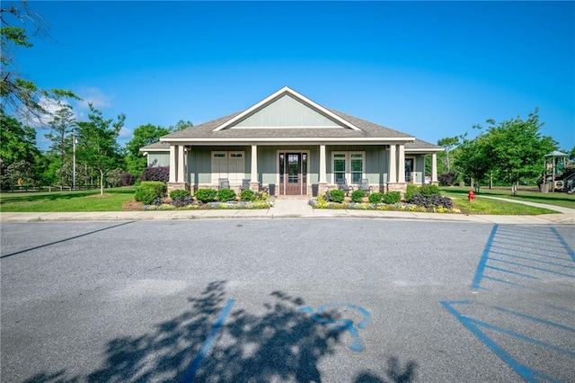 2526 Windmere Dr E, Semmes, AL 36575 - view of front facade featuring covered porch and board and batten siding
