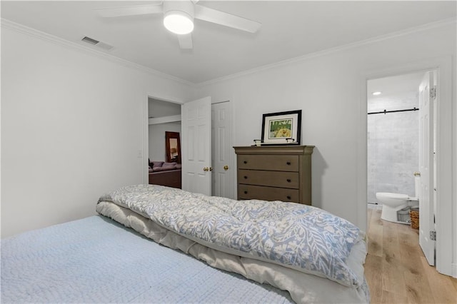 4689 Oak Ridge Rd, Mobile, AL 36609 - bedroom featuring light wood-type flooring, crown molding, ensuite bath, and ceiling fan