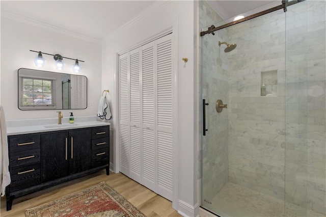 4689 Oak Ridge Rd, Mobile, AL 36609 - full bathroom featuring a closet, wood finished floors, a stall shower, and ornamental molding