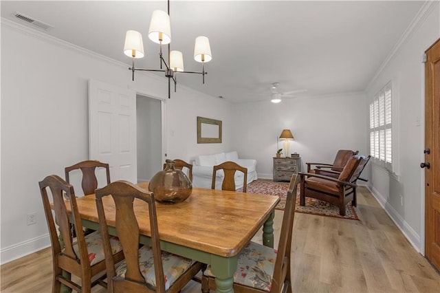4689 Oak Ridge Rd, Mobile, AL 36609 - dining area featuring ornamental molding, light wood finished floors, baseboards, a chandelier, and a ceiling fan