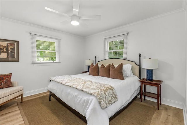 4689 Oak Ridge Rd, Mobile, AL 36609 - bedroom with light wood finished floors, multiple windows, crown molding, baseboards, and a ceiling fan