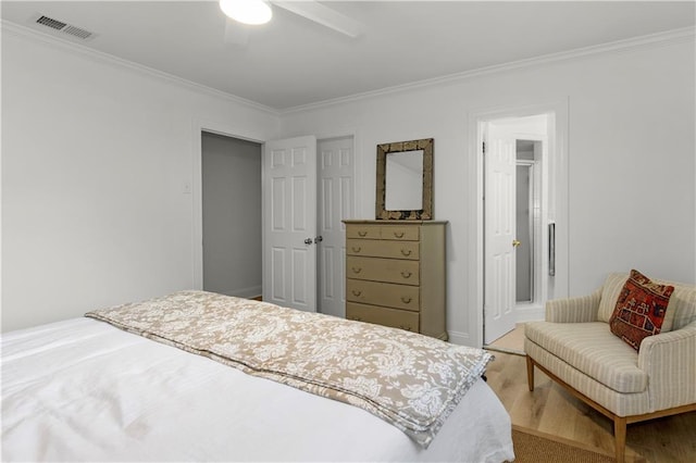 4689 Oak Ridge Rd, Mobile, AL 36609 - bedroom with wood finished floors, crown molding, and ceiling fan