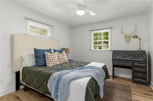 4689 Oak Ridge Rd, Mobile, AL 36609 - bedroom featuring ornamental molding, wood finished floors, baseboards, and ceiling fan