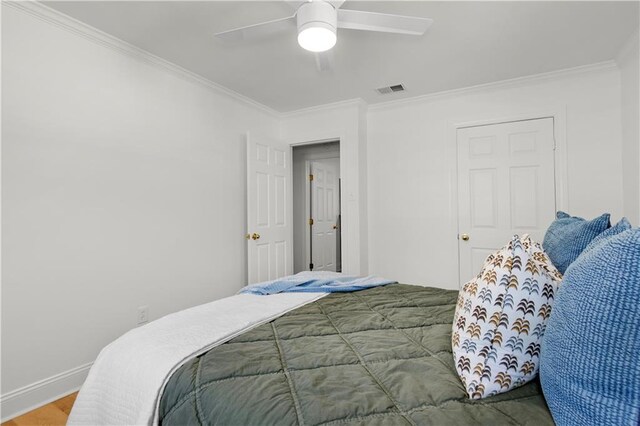 4689 Oak Ridge Rd, Mobile, AL 36609 - bedroom featuring ornamental molding, baseboards, ceiling fan, and wood finished floors